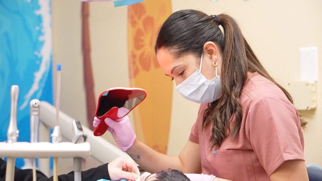 Assistant Showing Child Their Smile